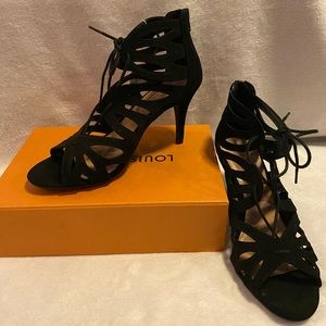 Black strap heel size 8.5 with one inch tall heel. Never worn.